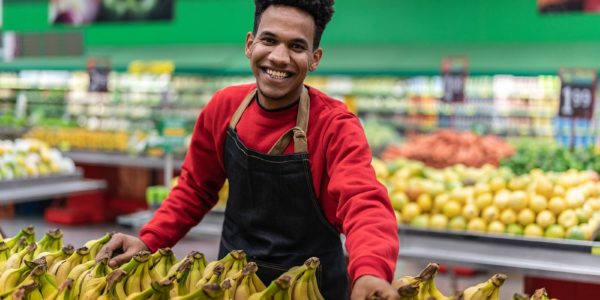 Man smiling in produce section