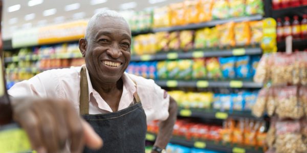 Man standing in grocery aisle