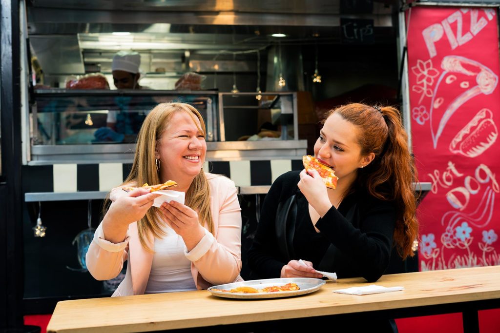 Women eating pizza