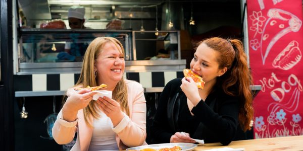 Women eating pizza